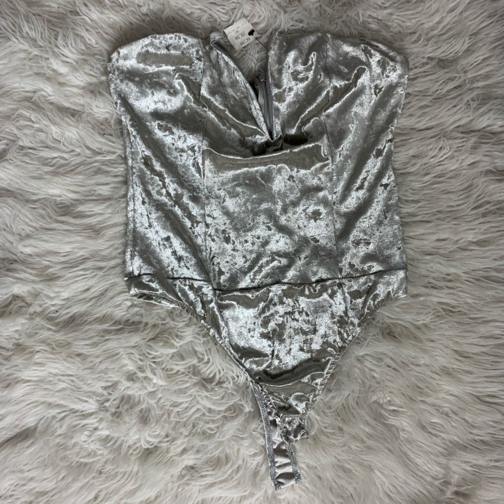 Akira sleeveless bodysuit top